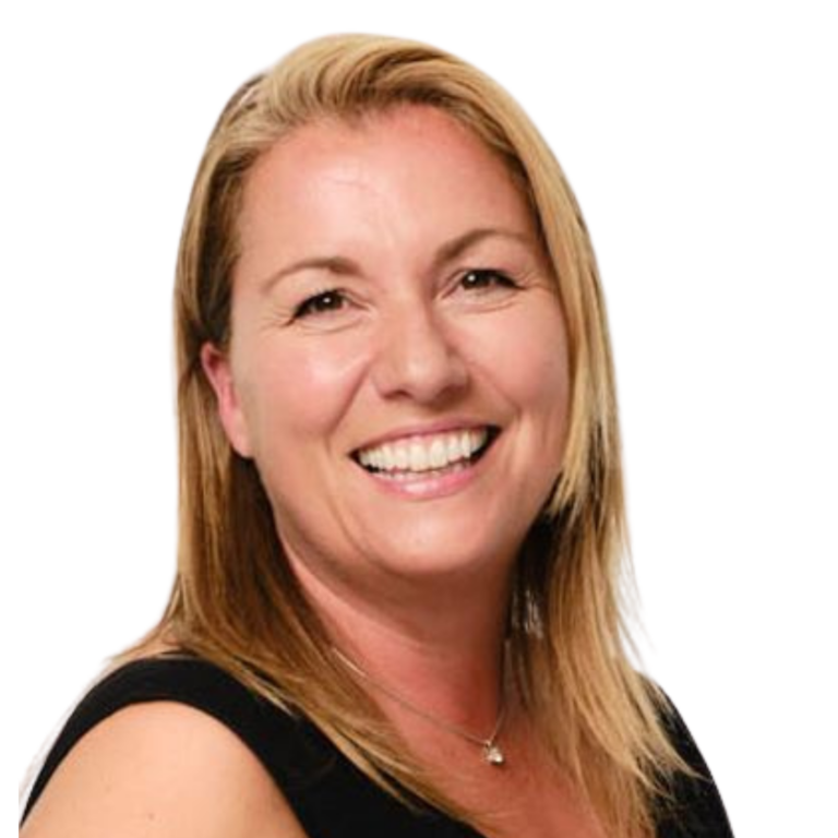 This is a picture of Nikki Gattenby. Nikki is a middle-aged white woman with shoulder-length blonde hair. She is wearing a dark vest and is smiling towards the camera.